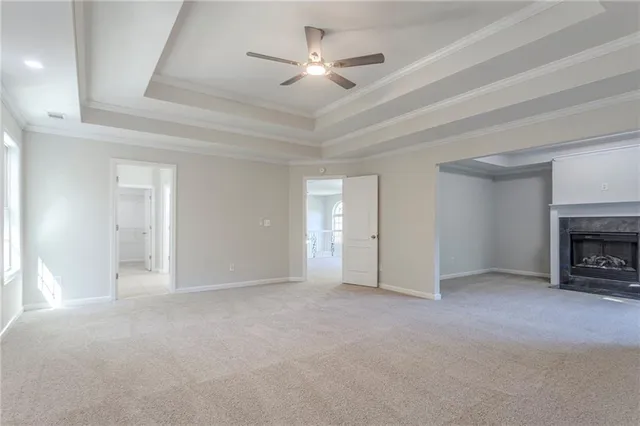 a view of empty room with a fireplace