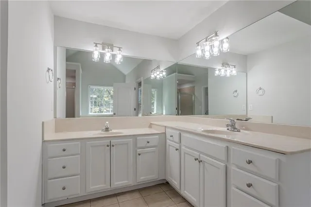 a bathroom with a sink double vanity and a mirror