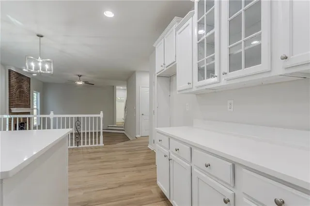 a kitchen that has a lot of cabinets in it