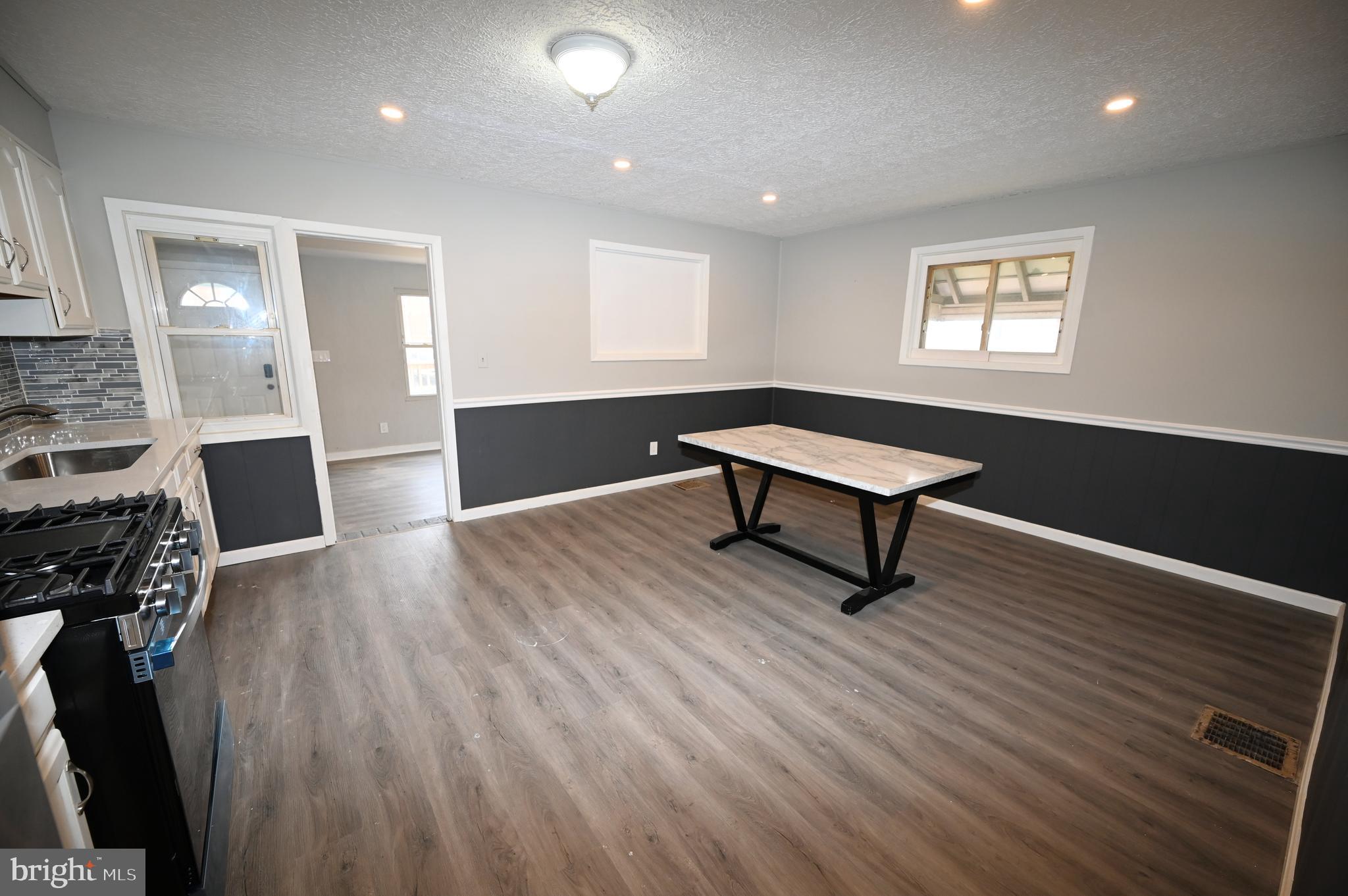 2952 Sollers Point Road, Unit B Dundalk, MD 21222 - Photo 21 of 37 a living room with furniture and a wooden floor