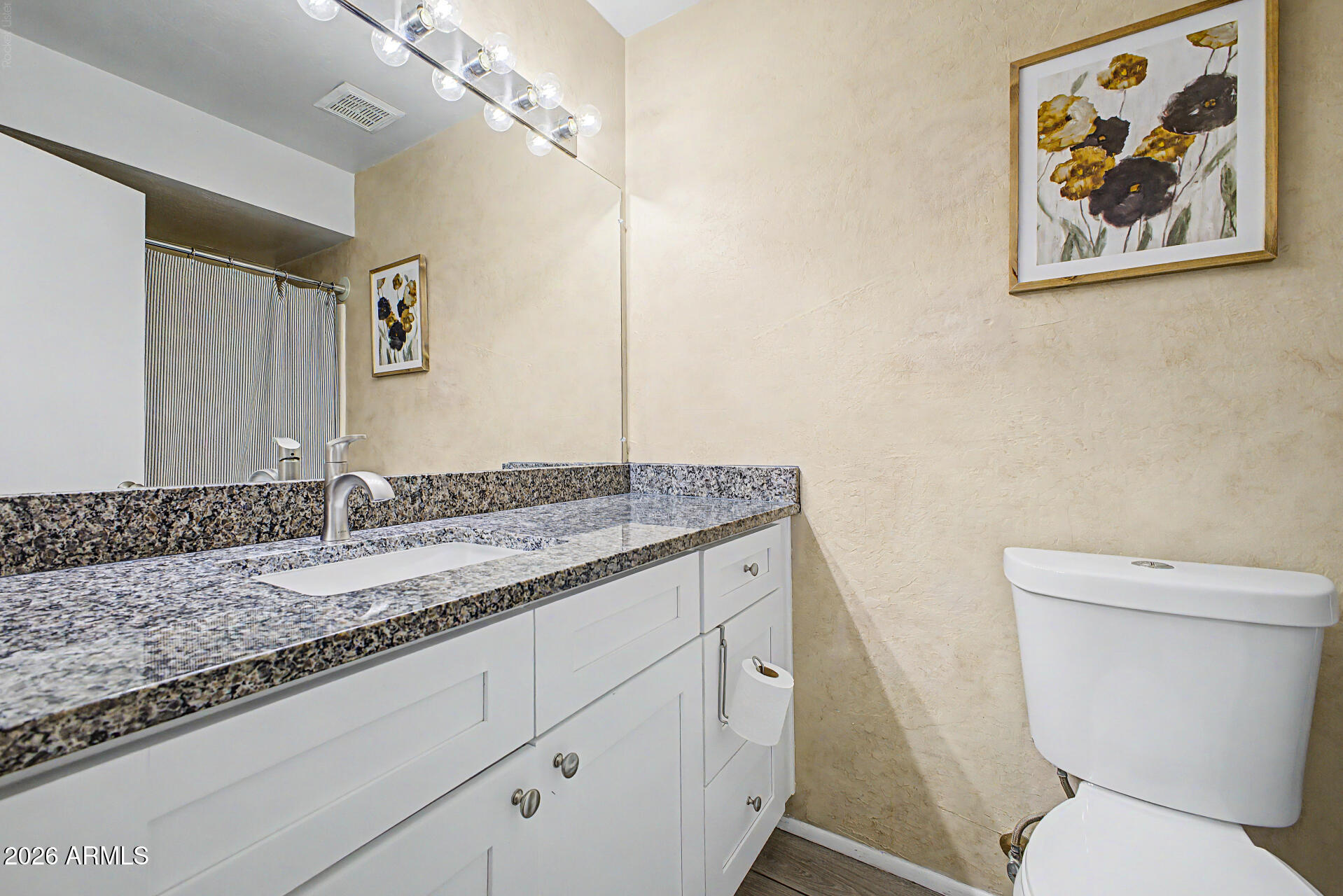 2455 East Broadway Road, Unit 103 Mesa, AZ 85204 - Photo 18 of 22 a bathroom with a granite countertop sink mirror vanity and toilet