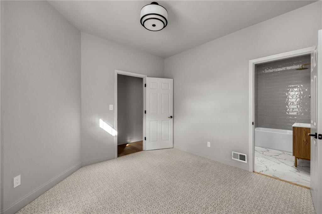 322 East Main Street Ligonier, PA 15658 - Photo 22 of 31 a view of empty room with window and wooden floor