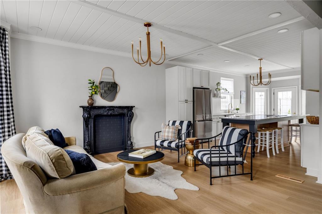 322 East Main Street Ligonier, PA 15658 - Photo 4 of 31 a living room with furniture kitchen view and a wooden floor