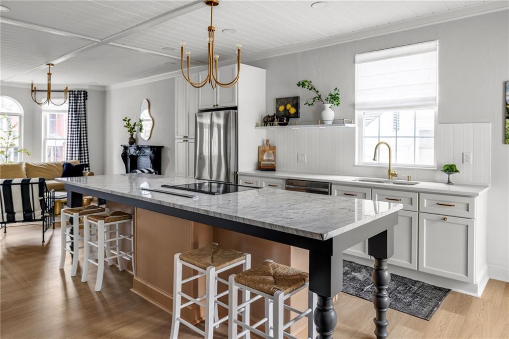 322 East Main Street Ligonier, PA 15658 - Photo 6 of 31 a kitchen with a table chairs sink and cabinets