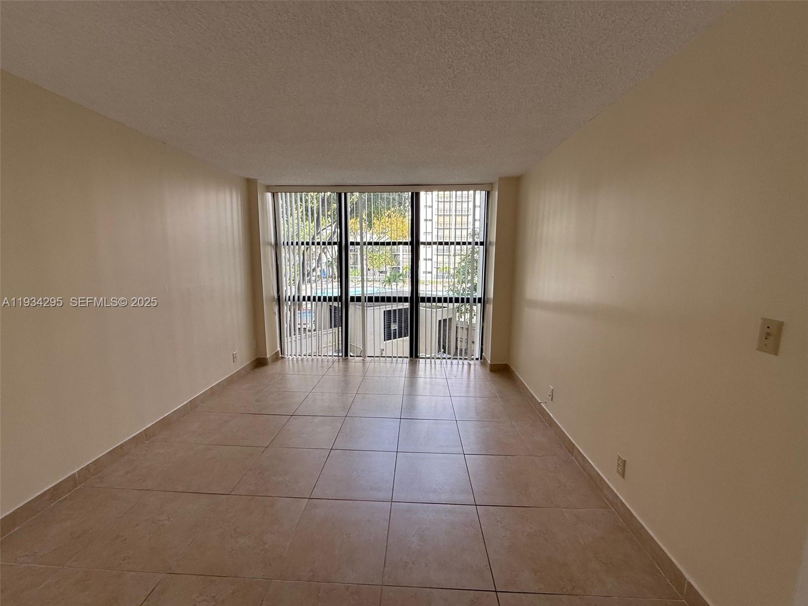 16919 North Bay Road, Unit 204 Sunny Isles Beach, FL 33160 - Photo 17 of 42 a view of an empty room with a window