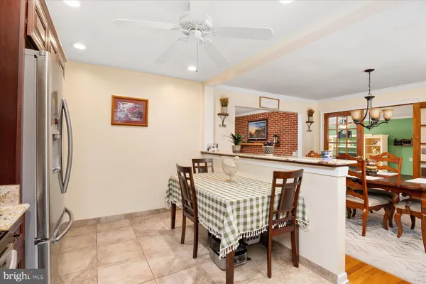 a dining room with furniture and window