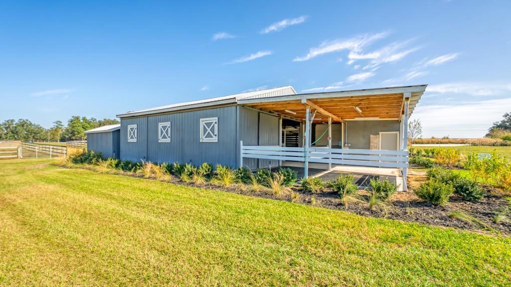 15305 Northwest 112th Place Road Morriston, FL 32668 - Photo 13 of 95 a front view of a house with a garden