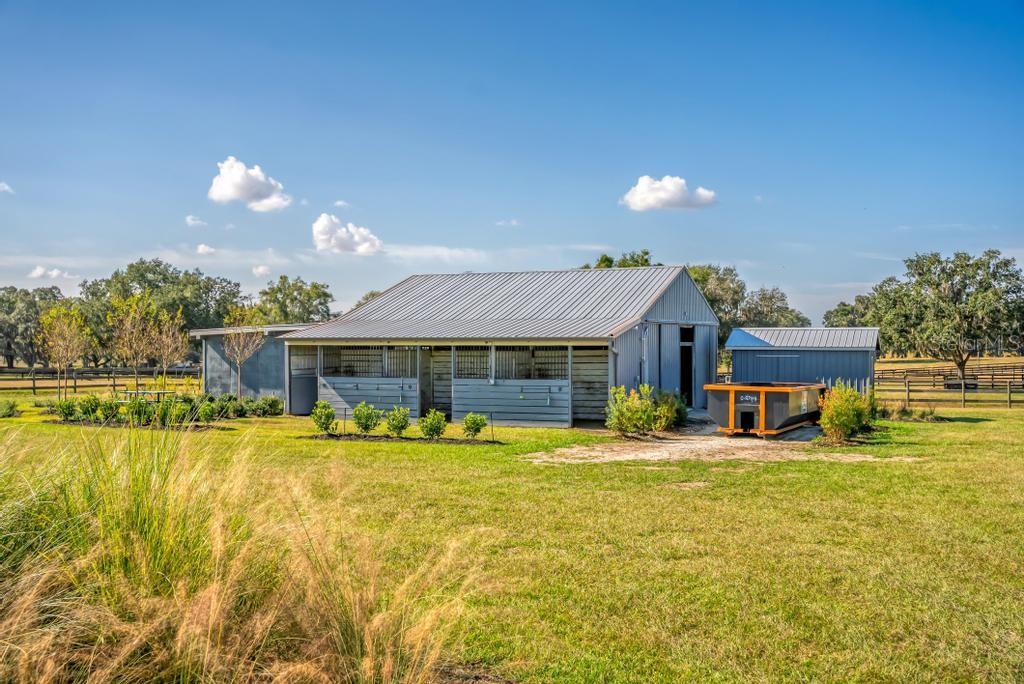 15305 Northwest 112th Place Road Morriston, FL 32668 - Photo 28 of 95 a house view with swimming pool and trees in the background