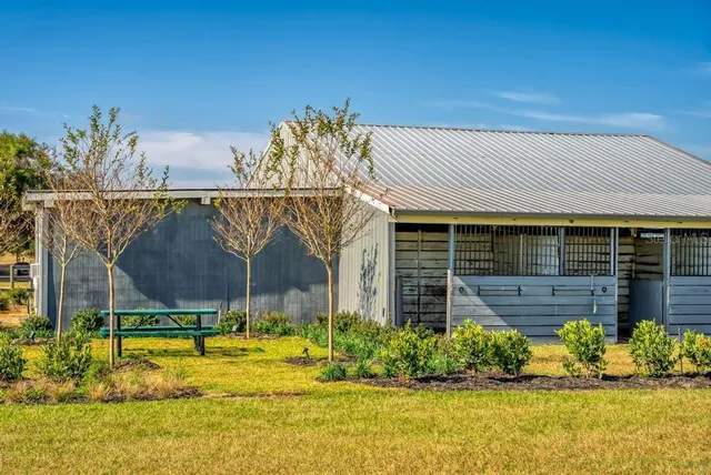 a kitchen with sink and mirror
