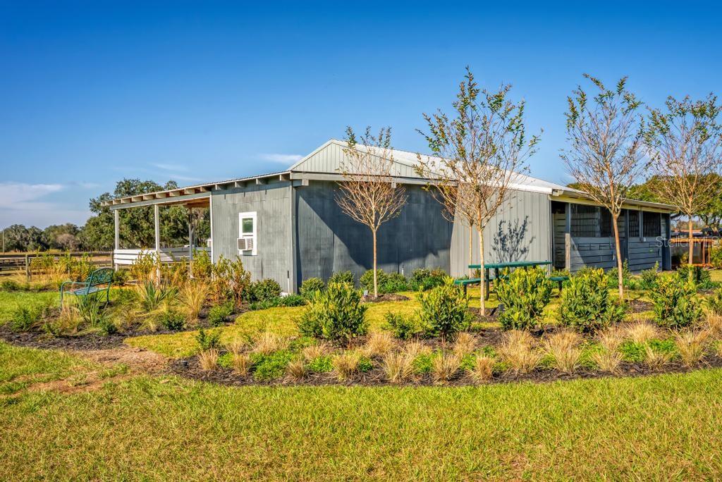 15305 Northwest 112th Place Road Morriston, FL 32668 - Photo 32 of 95 a front view of a house with a garden