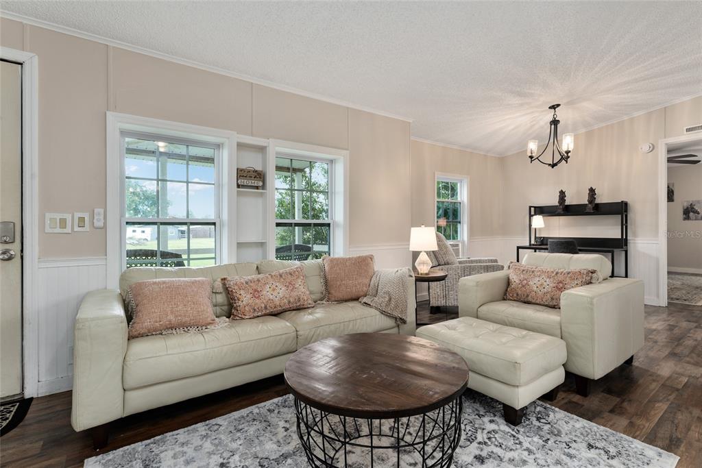 15305 Northwest 112th Place Road Morriston, FL 32668 - Photo 48 of 95 a living room with furniture and a large window