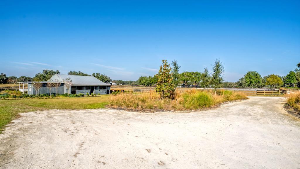 15305 Northwest 112th Place Road Morriston, FL 32668 - Photo 6 of 95 a view of swimming pool with an ocean view