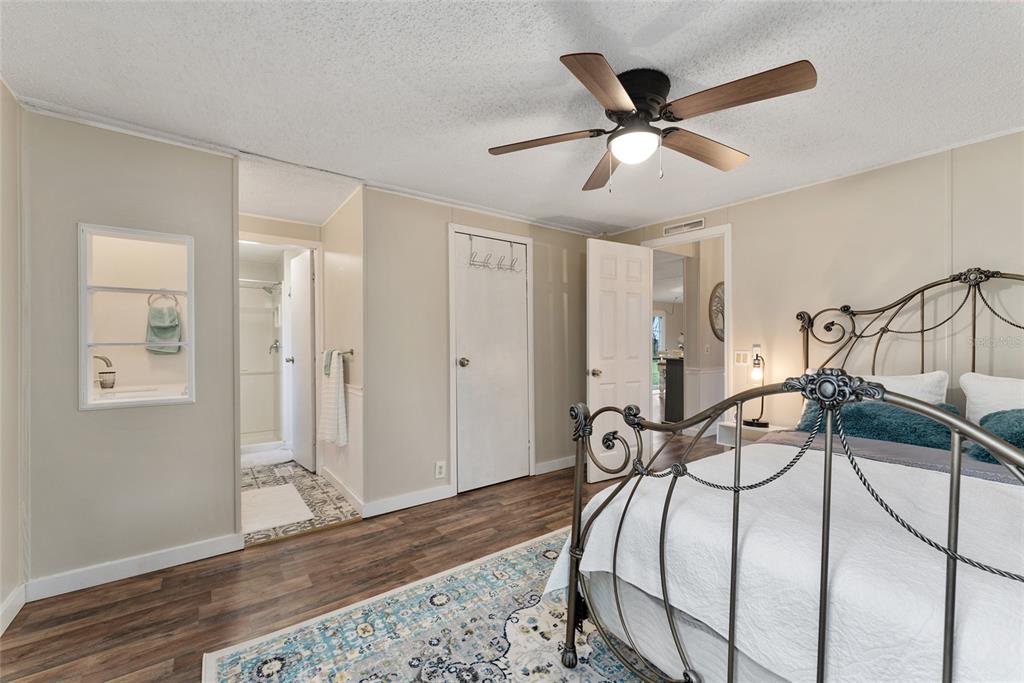 15305 Northwest 112th Place Road Morriston, FL 32668 - Photo 63 of 95 a view of a livingroom with furniture and a ceiling fan