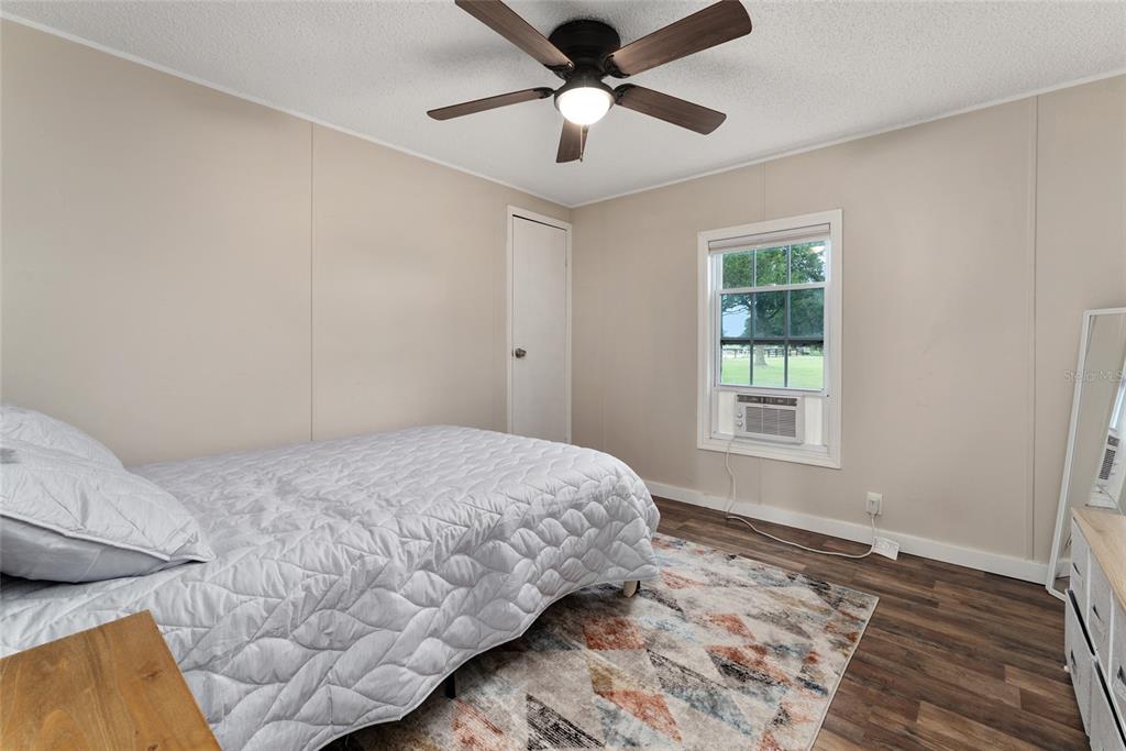 15305 Northwest 112th Place Road Morriston, FL 32668 - Photo 68 of 95 a bedroom with a bed and a window