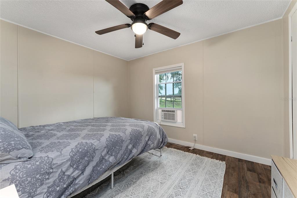 15305 Northwest 112th Place Road Morriston, FL 32668 - Photo 70 of 95 a bedroom with a bed and a window
