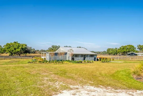 a view of a swimming pool with an outdoor space and seating area