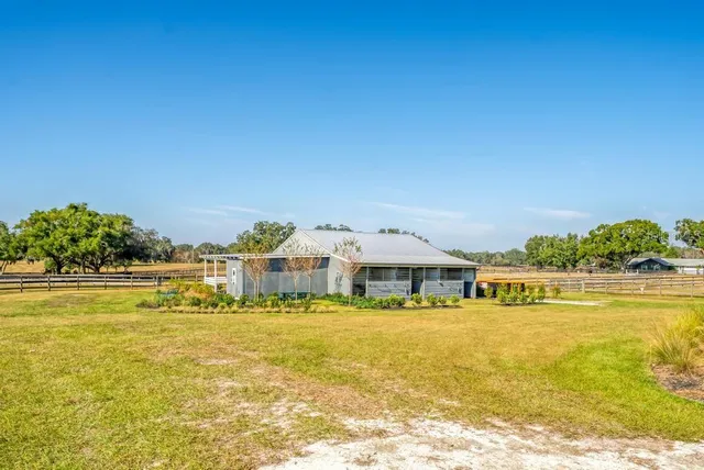 a view of a swimming pool with an outdoor space and seating area