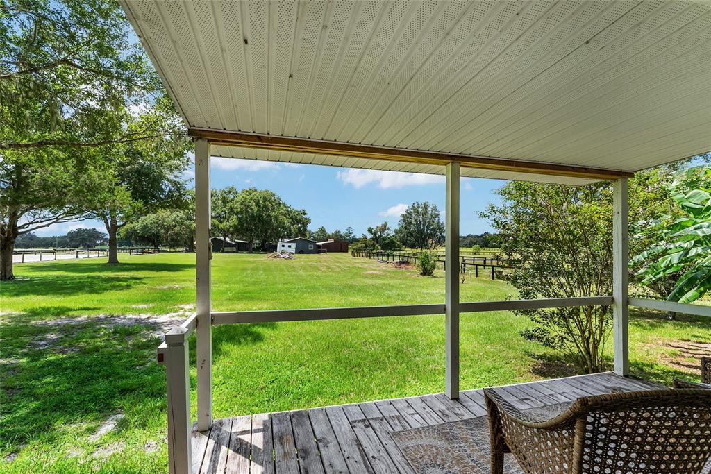 15305 Northwest 112th Place Road Morriston, FL 32668 - Photo 76 of 95 a view of a house with backyard from a patio