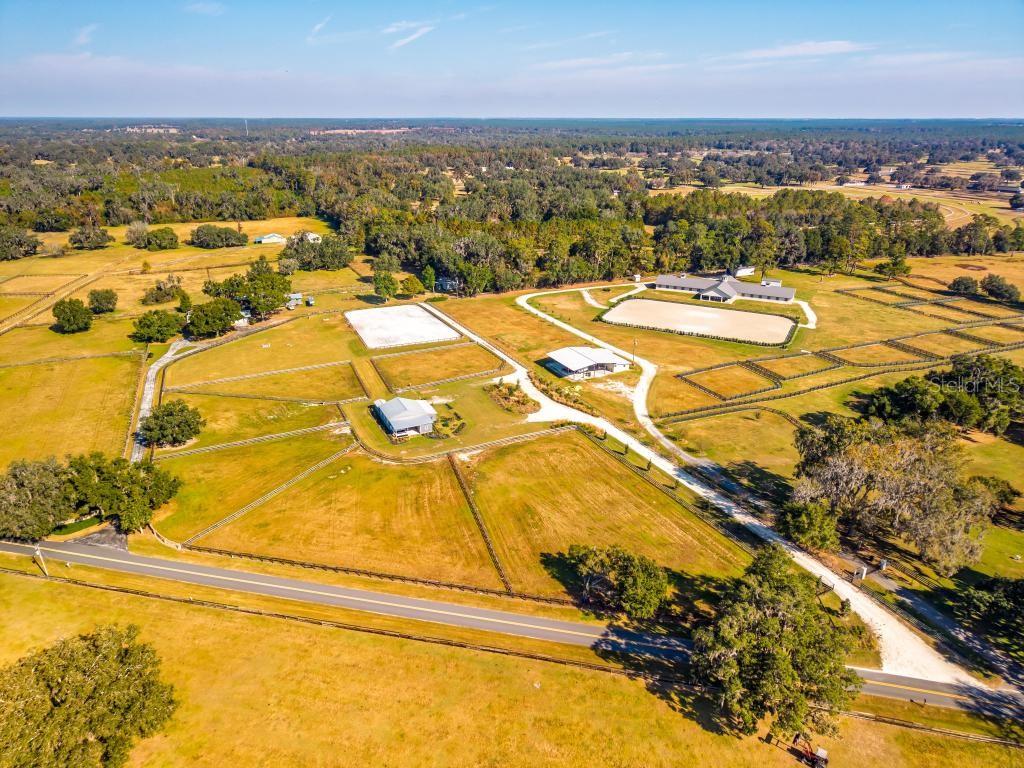 15305 Northwest 112th Place Road Morriston, FL 32668 - Photo 79 of 95 a view of a swimming pool with an ocean view