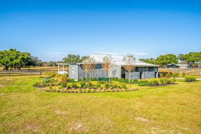 a view of an ocean with a table and chairs