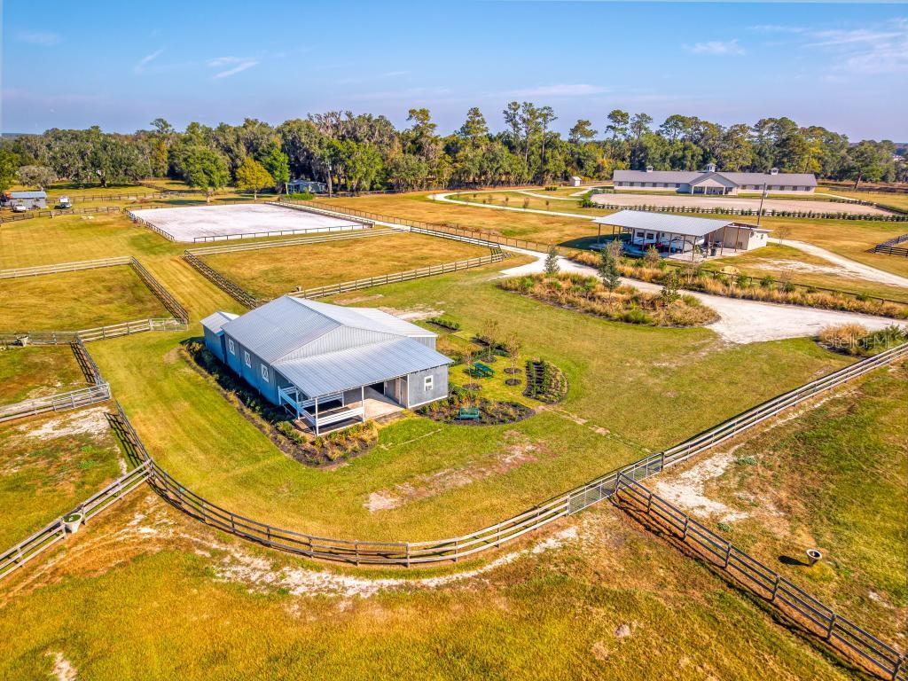 15305 Northwest 112th Place Road Morriston, FL 32668 - Photo 93 of 95 a view of a swimming pool with an outdoor seating and a ocean view