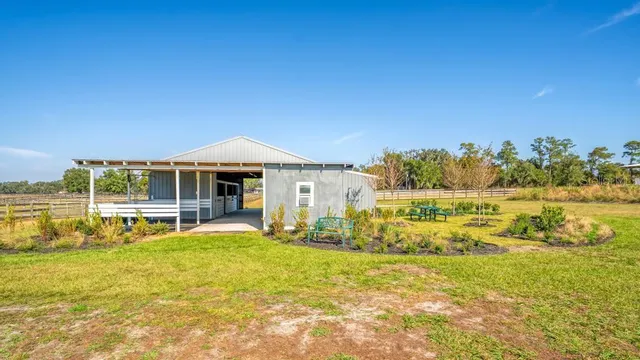 a front view of a house with a big yard