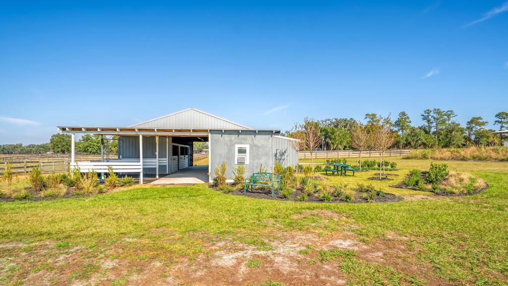15305 Northwest 112th Place Road Morriston, FL 32668 - Photo 10 of 95 a front view of house with yard and seating area