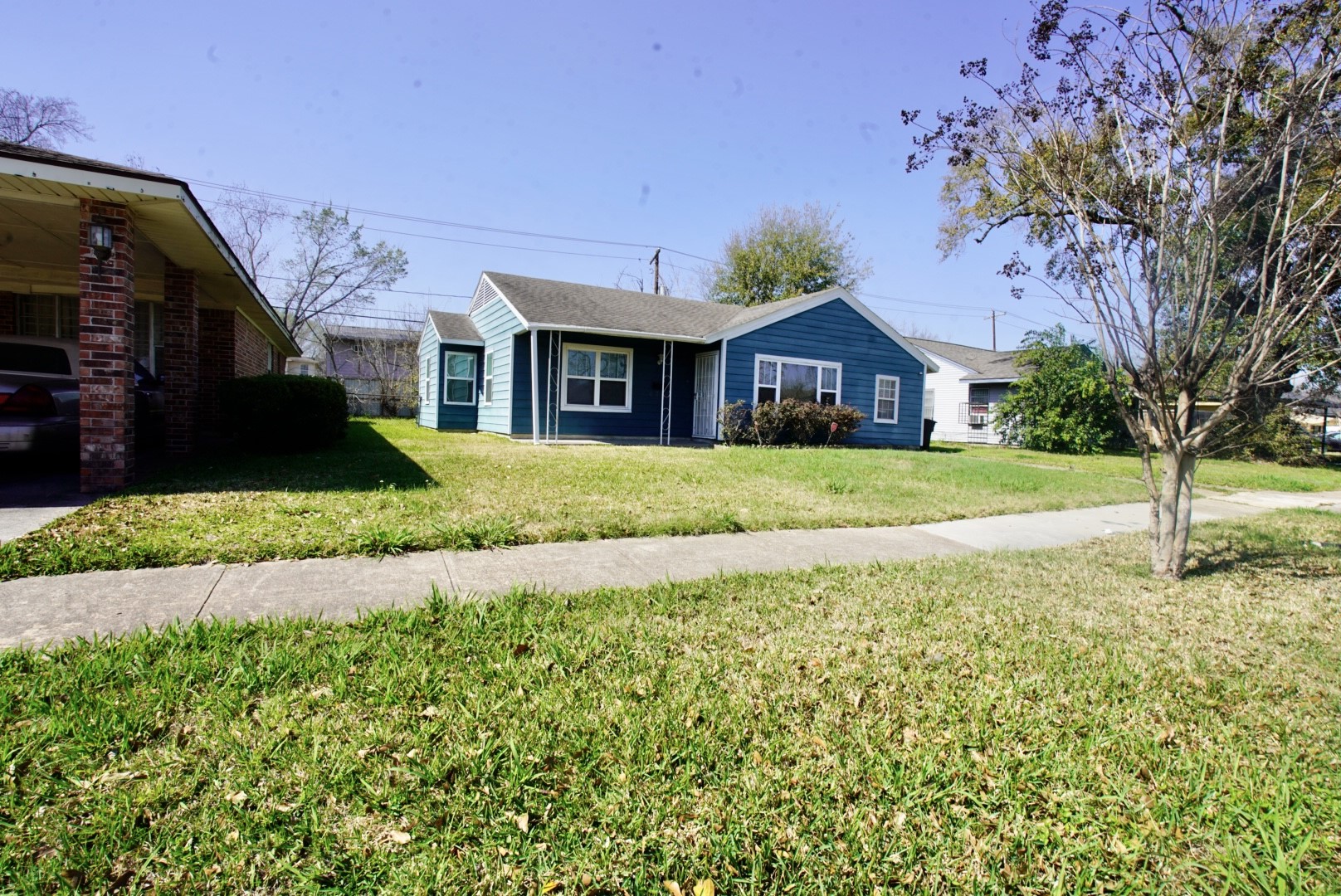 6814 Tierwester Street Houston, TX 77021 - Photo 1 of 13 a front view of a house with a yard and garage