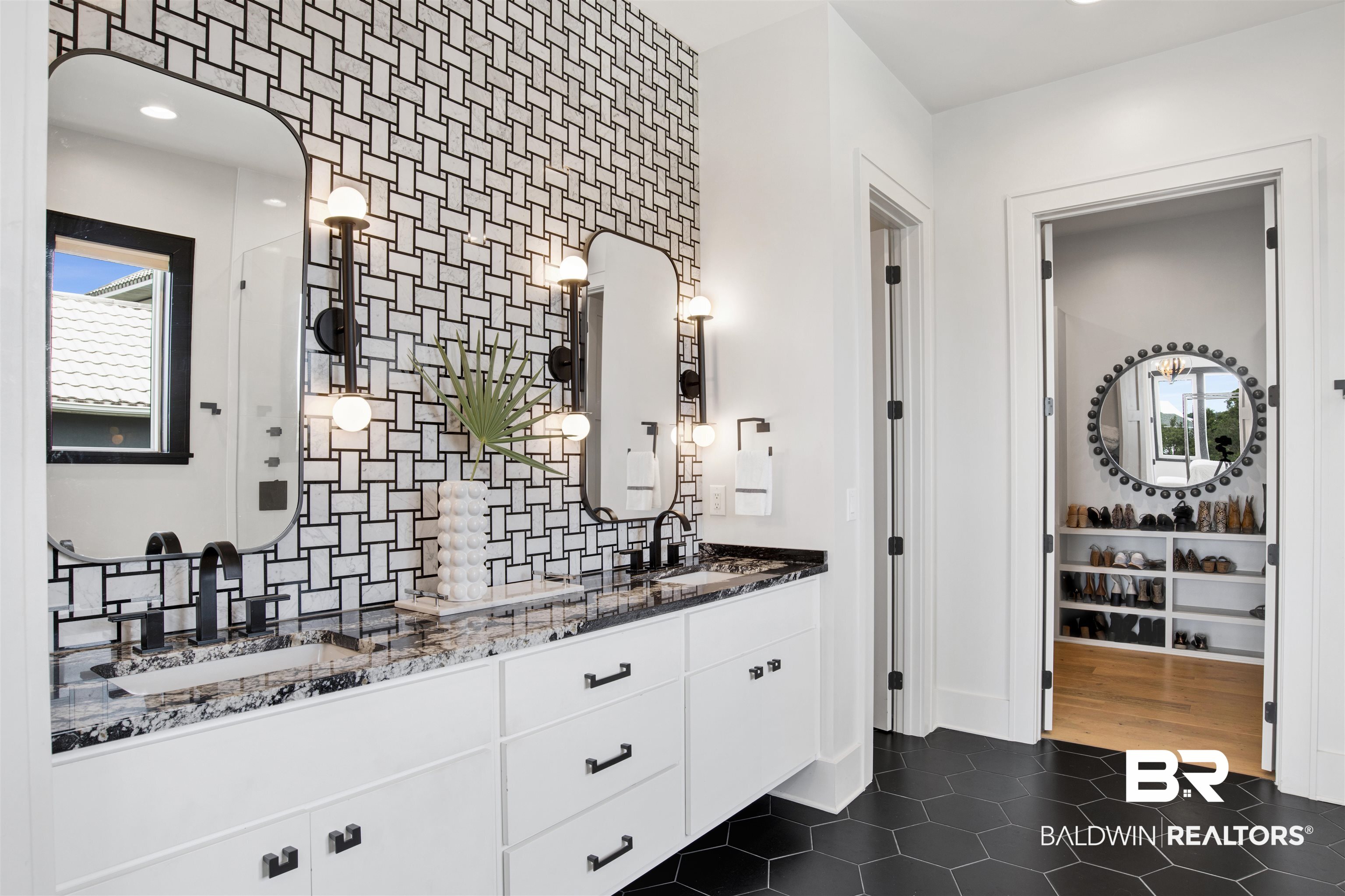30239 Canal Court Orange Beach, AL 36561 - Photo 34 of 70 Full bath with double vanity, dark tile patterned flooring, recessed lighting, and decorative backsplash