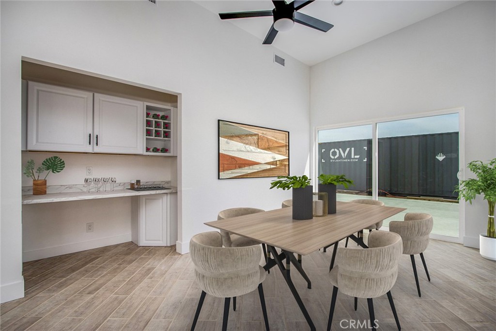 62474 Golden Street Joshua Tree, CA 92252 - Photo 20 of 31 a view of a dining room with furniture and wooden floor
