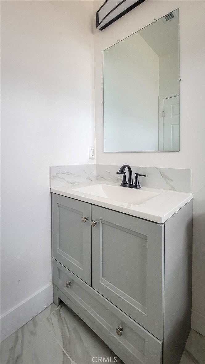 62474 Golden Street Joshua Tree, CA 92252 - Photo 28 of 31 a bathroom with a sink and a mirror