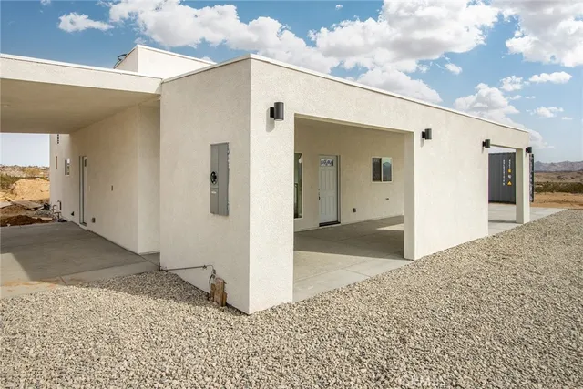 a view of a big house with a outdoor space