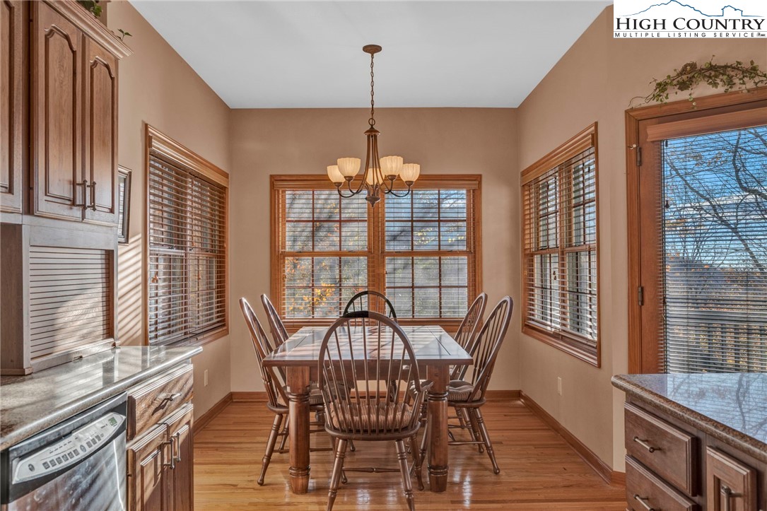 121 Spruce Hollow Road Beech Mountain, NC 28604 - Photo 14 of 50 a view of a dining room with furniture window and outside view