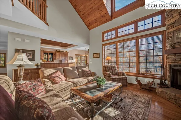 a living room with furniture or couch and a large window