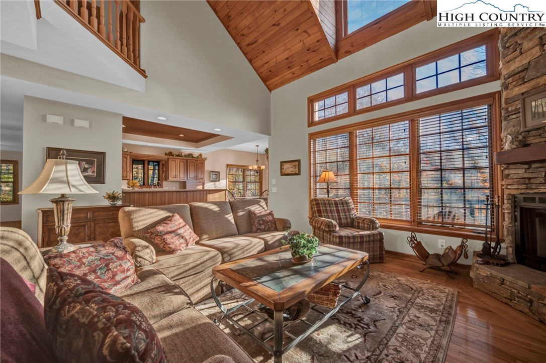 121 Spruce Hollow Road Beech Mountain, NC 28604 - Photo 17 of 50 a living room with furniture or couch and a large window