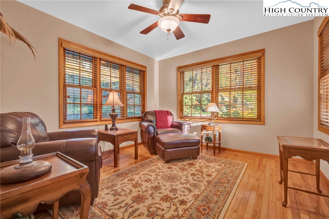 121 Spruce Hollow Road Beech Mountain, NC 28604 - Photo 26 of 50 a living room with furniture and a large window