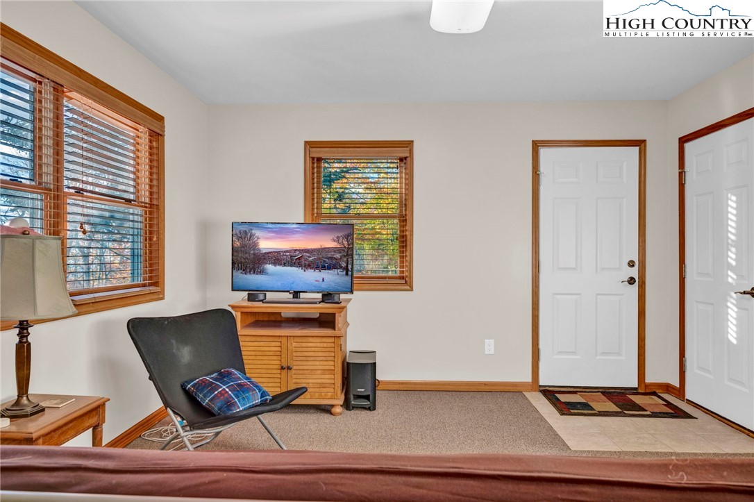 121 Spruce Hollow Road Beech Mountain, NC 28604 - Photo 38 of 50 a room with furniture and window