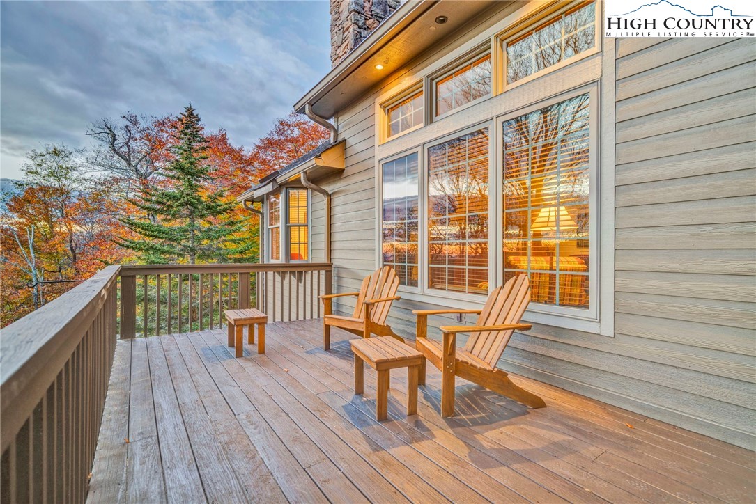 121 Spruce Hollow Road Beech Mountain, NC 28604 - Photo 48 of 50 a view of a two chairs and table on the wooden floor