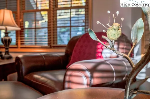 a view of a livingroom with furniture and chandelier