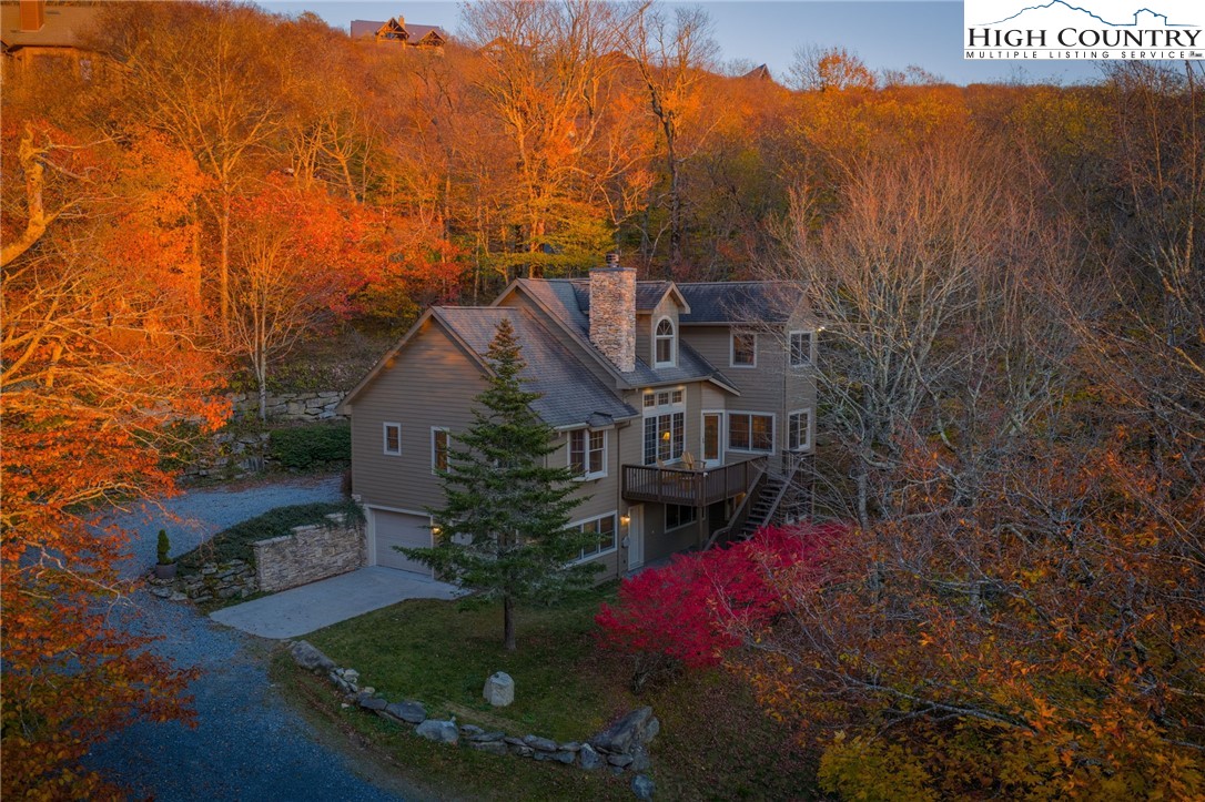 121 Spruce Hollow Road Beech Mountain, NC 28604 - Photo 7 of 50 a view of a house with a yard