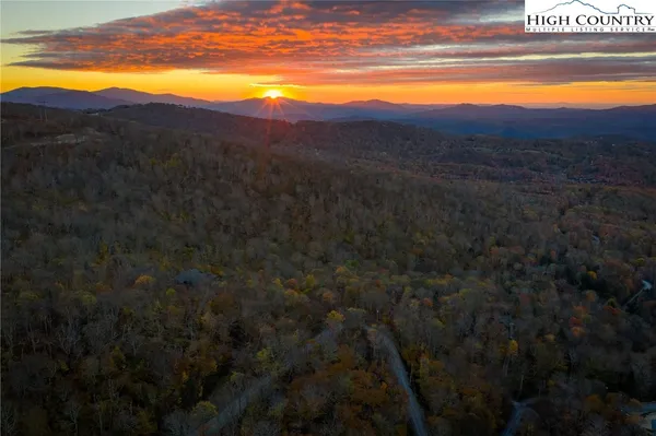 a view of an ocean and a mountain