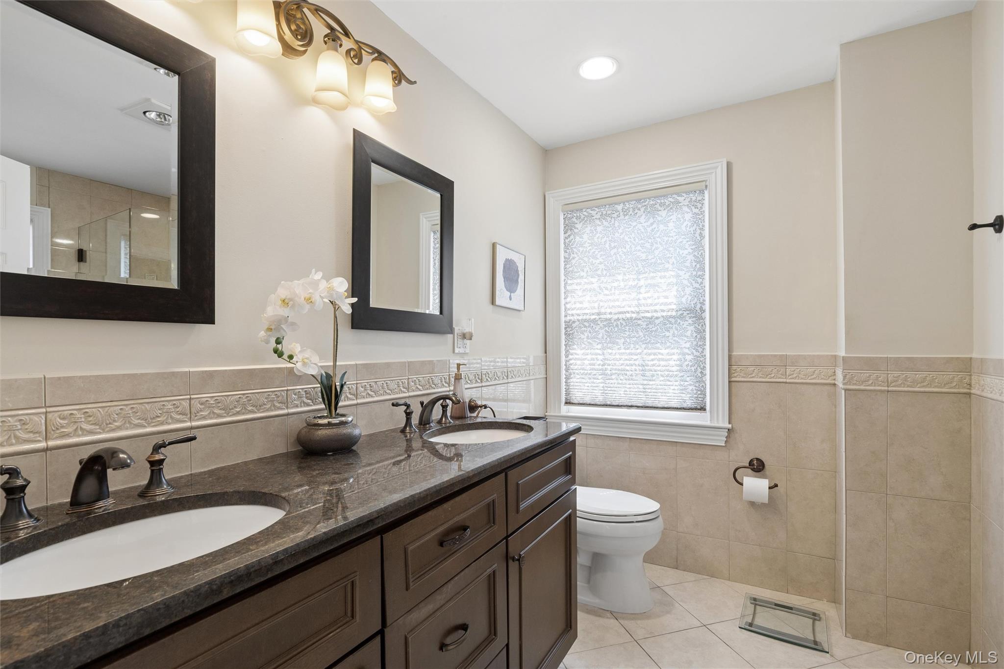 50 Belton Road Babylon, NY 11702 - Photo 22 of 34 The master bath is beautifully tiled and has dual sinks and a separate shower as well as a tub with jacuzzi jets. A perfect retreat!