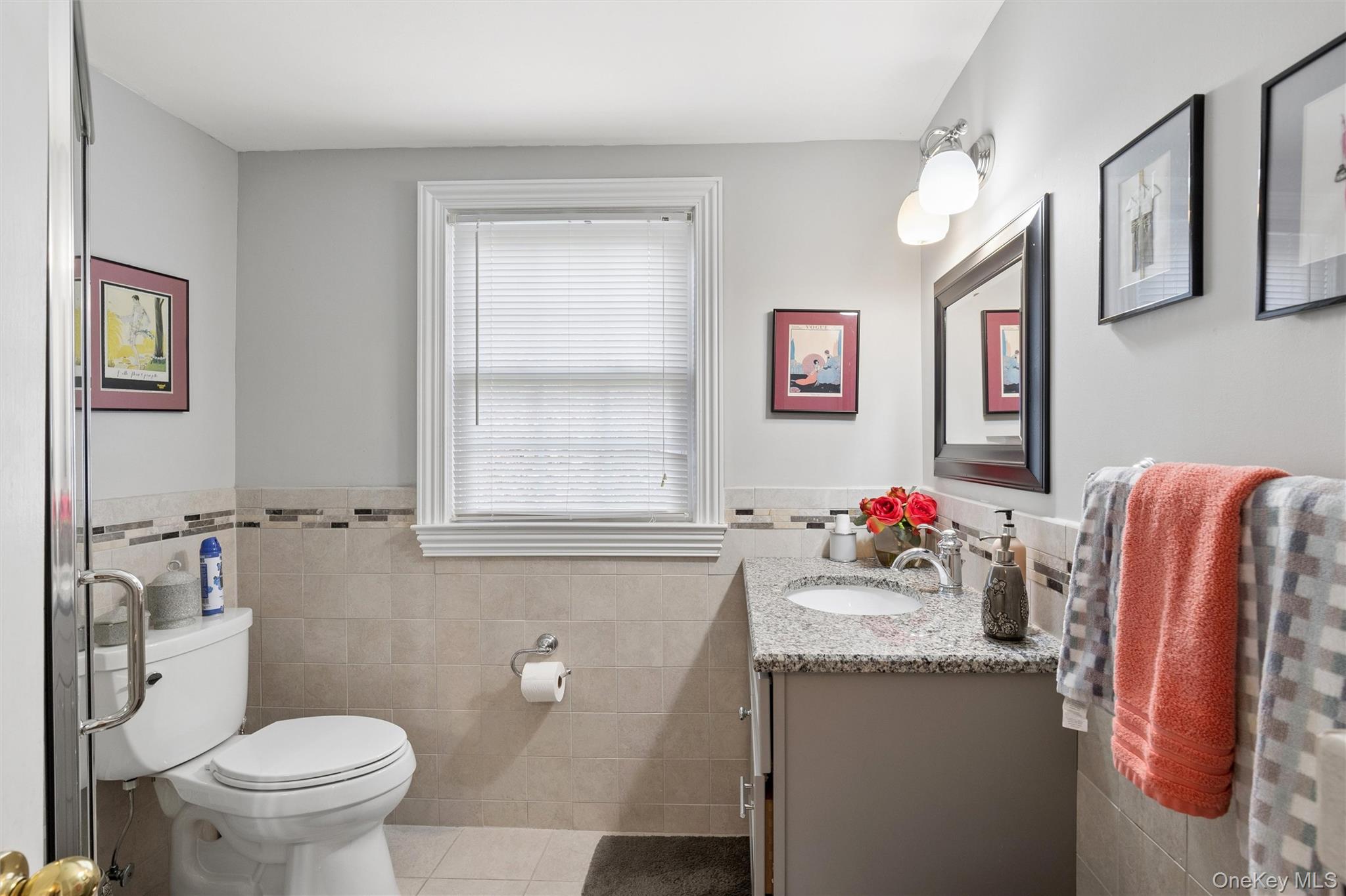 50 Belton Road Babylon, NY 11702 - Photo 26 of 34 The hallway bath has a shower stall, tile walls and floor and is easily accessed from either upstairs bedroom