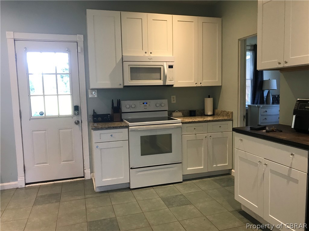 347 Lillys Neck Road Moon, VA 23119 - Photo 10 of 45 Kitchen featuring white cabinetry, white appliances, and tile patterned floors