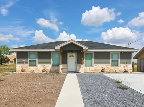 a front view of a house with a patio
