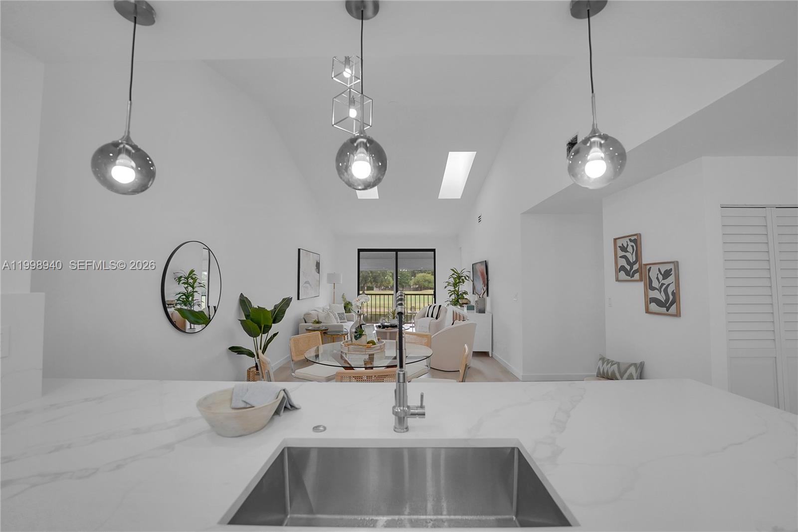 7736 La Mirada Drive Boca Raton, FL 33433 - Photo 13 of 56 a kitchen with a sink and a stove top oven