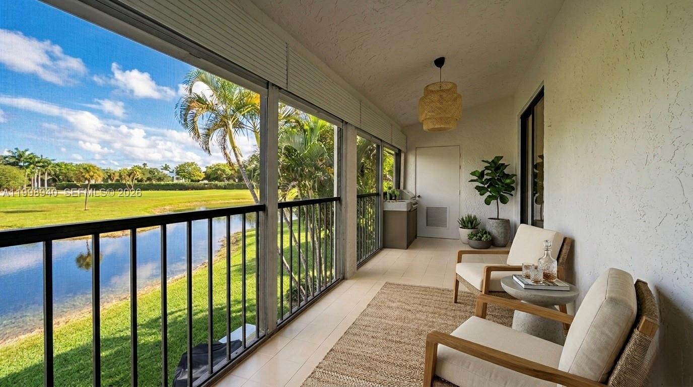 7736 La Mirada Drive Boca Raton, FL 33433 - Photo 40 of 56 a balcony with chairs
