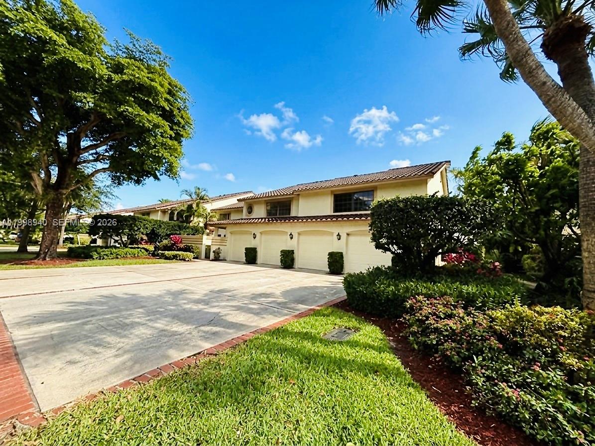 7736 La Mirada Drive Boca Raton, FL 33433 - Photo 47 of 56 a view of a house with a yard and pathway
