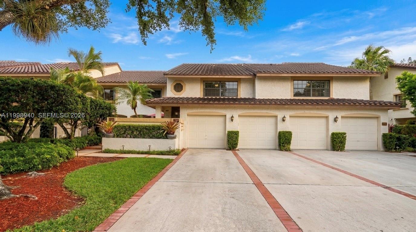 7736 La Mirada Drive Boca Raton, FL 33433 - Photo 48 of 56 a front view of a house with a yard and garage