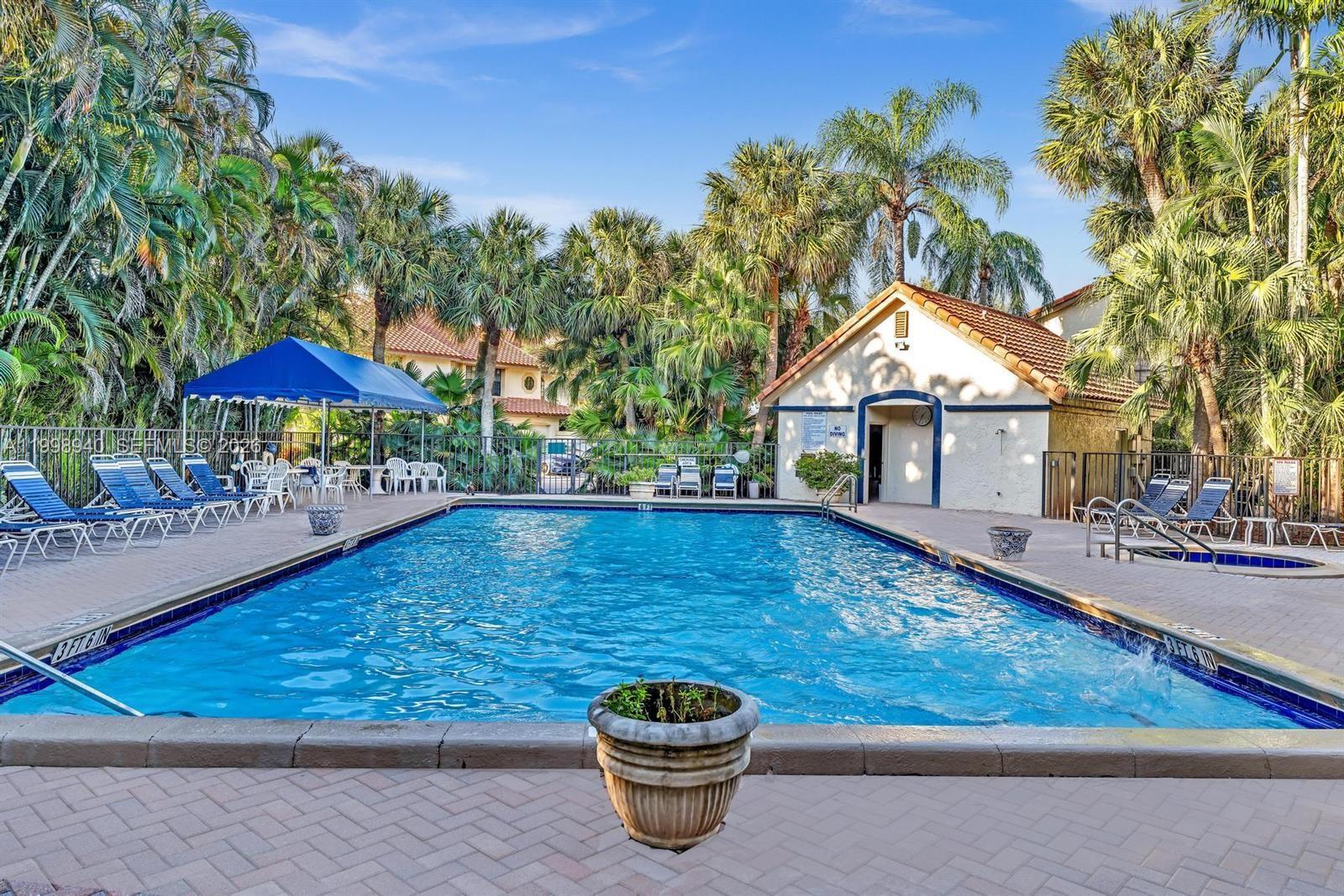 7736 La Mirada Drive Boca Raton, FL 33433 - Photo 51 of 56 a view of a patio with chairs and a table